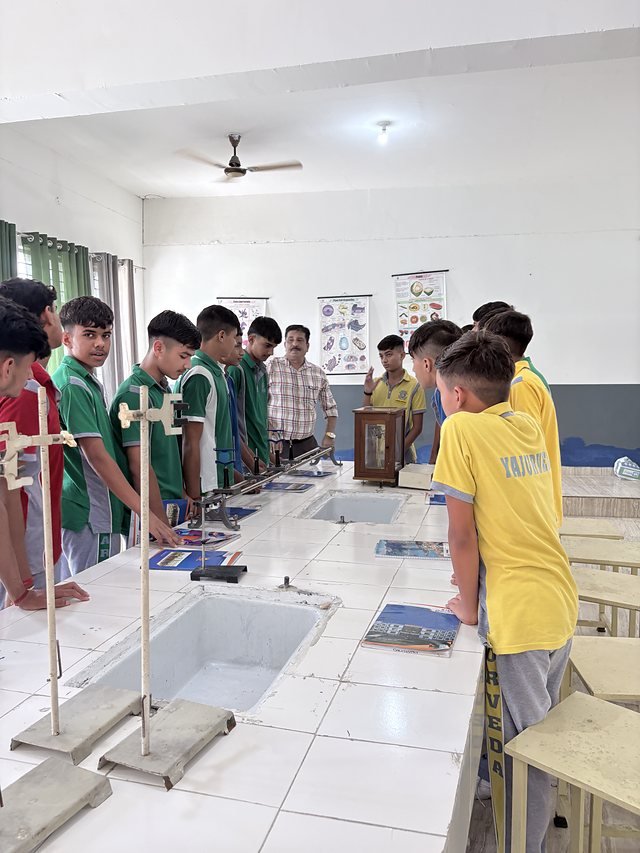 Students working at chemistry lab benches
